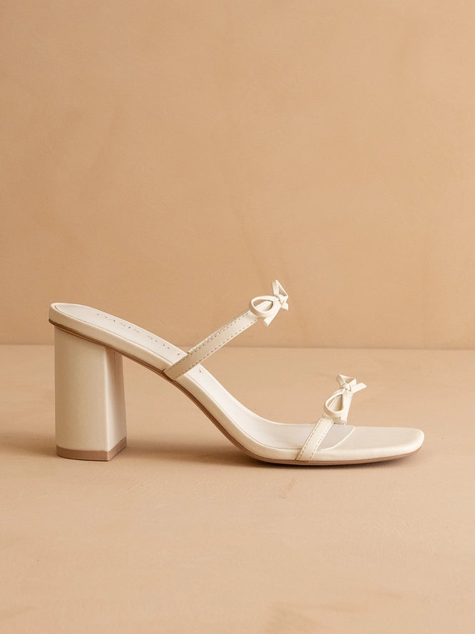 f4d6de50b869c75ecce51451a3dca093ee45de7f4a3330b55e6ebf3e13c08842.jpg Wendy Cream Double Strap Bow Heels